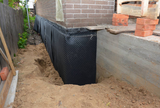 SJ Waterproofing Pros technician performing targeted Vapor Barrier Installation assessment in Reynolds, IN